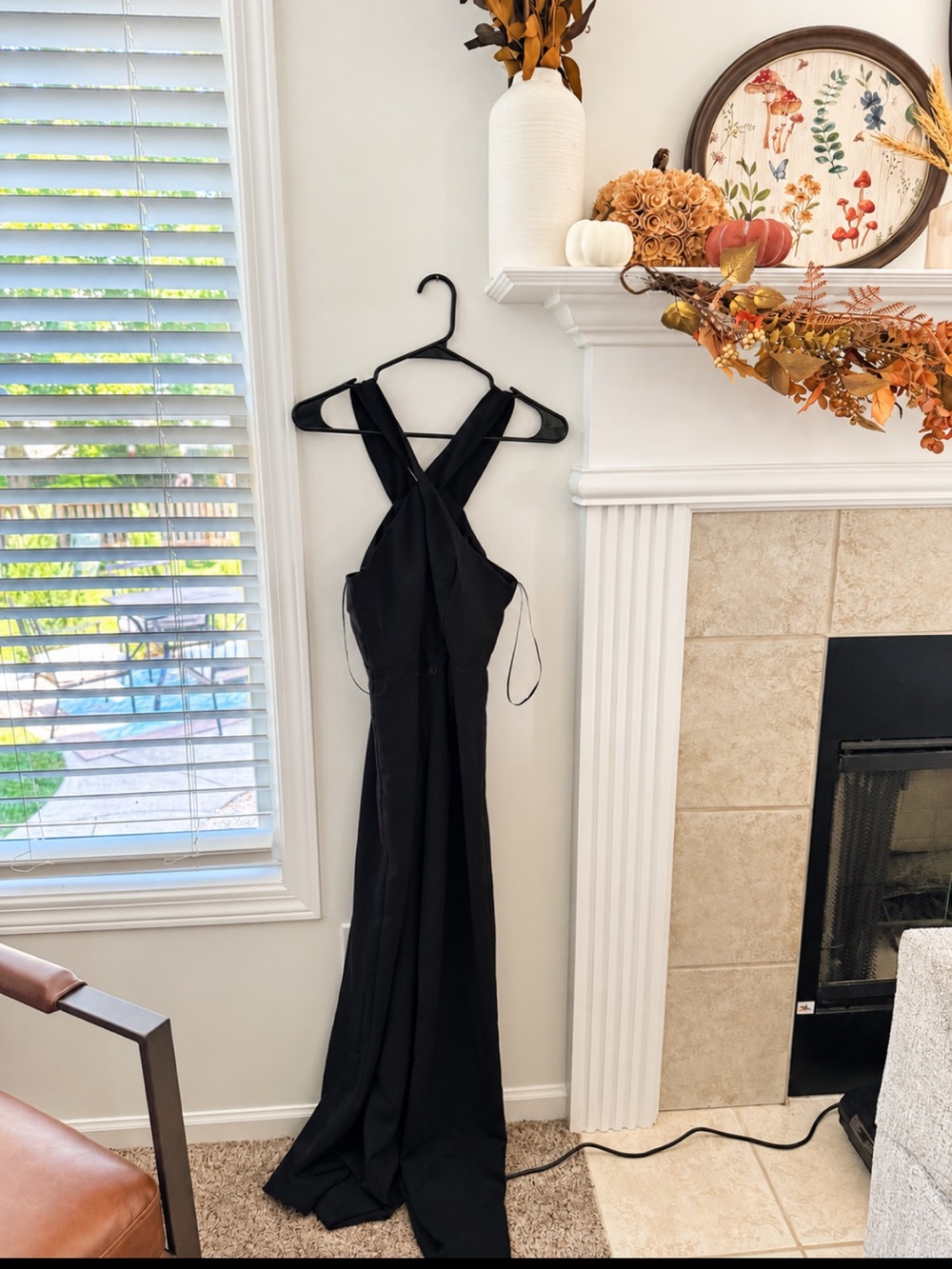 black cross-front halter jumpsuit.